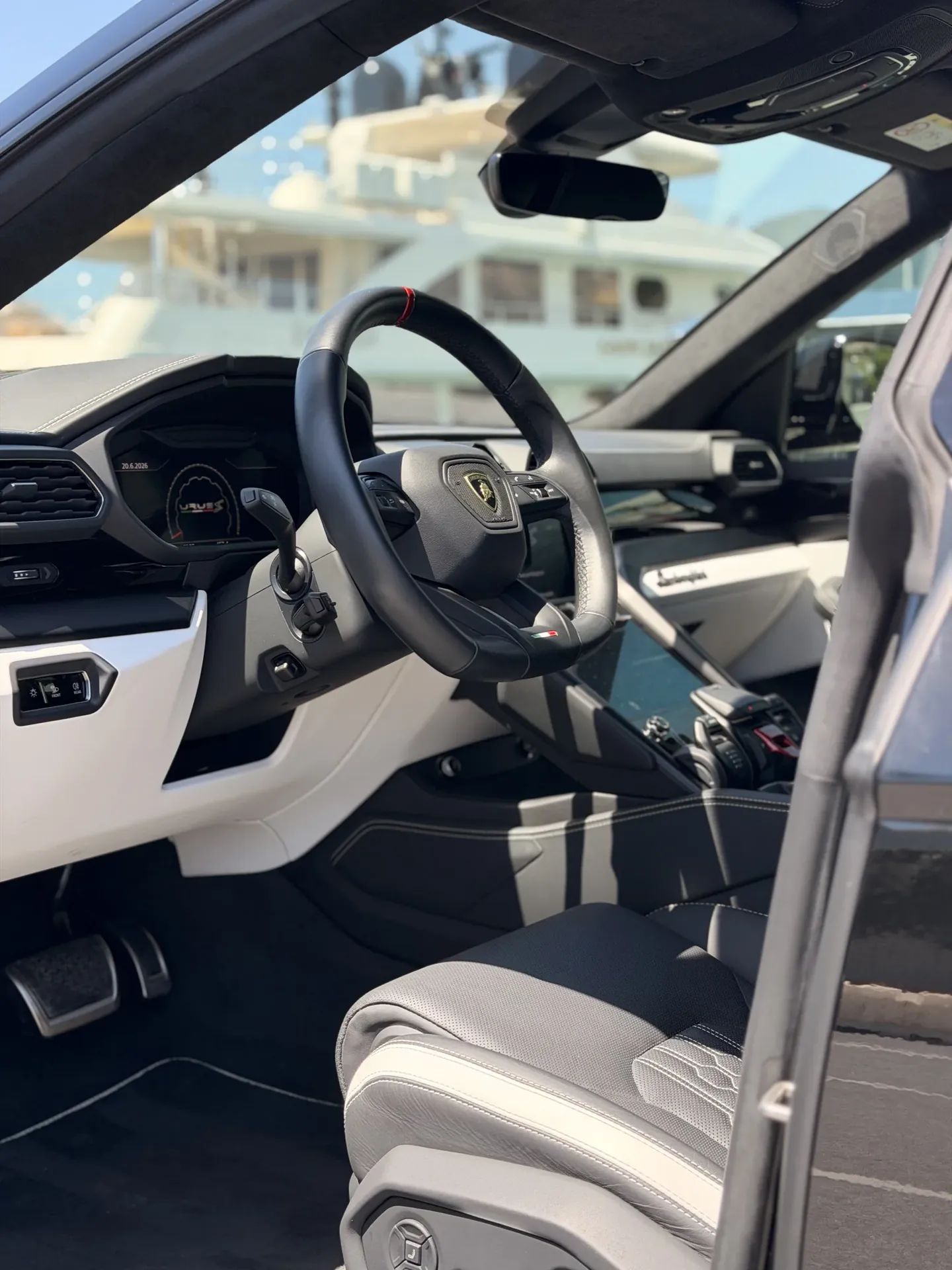 Lamborghini Urus steering wheel and centre console with light and dark cabin trim